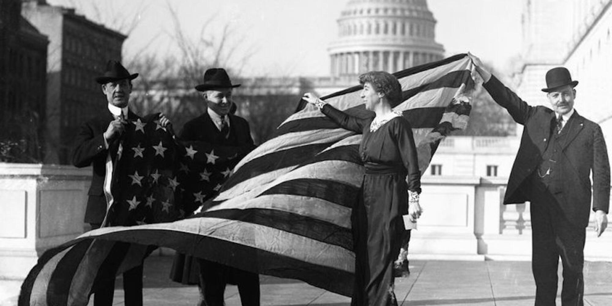  Jeanette Rankin, first Woman elected to Congress, receiving the flag of the House of Representatives upon passage of women's suffrage.