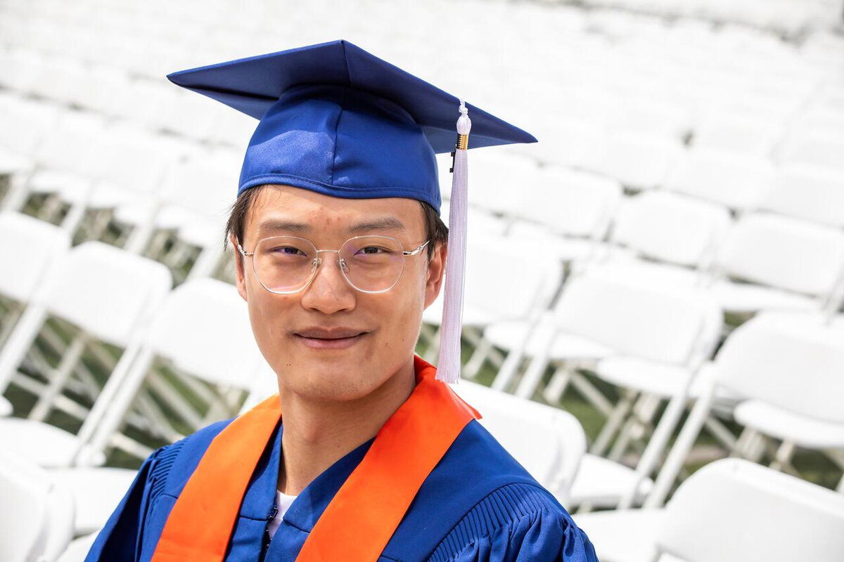 recent graduate in cap and gown